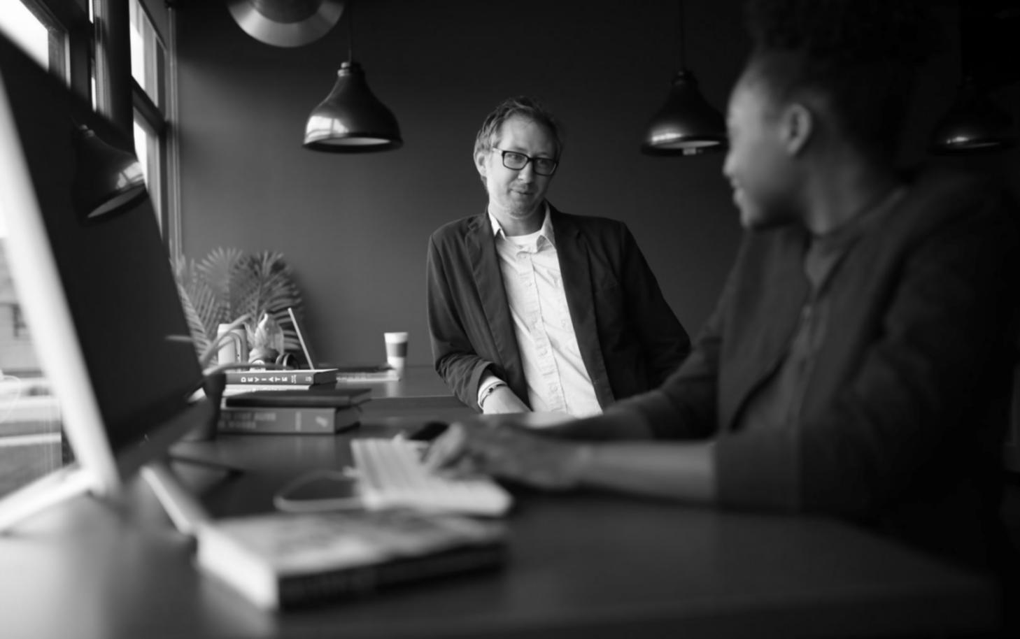 Business owner reviewing financial records and making notes