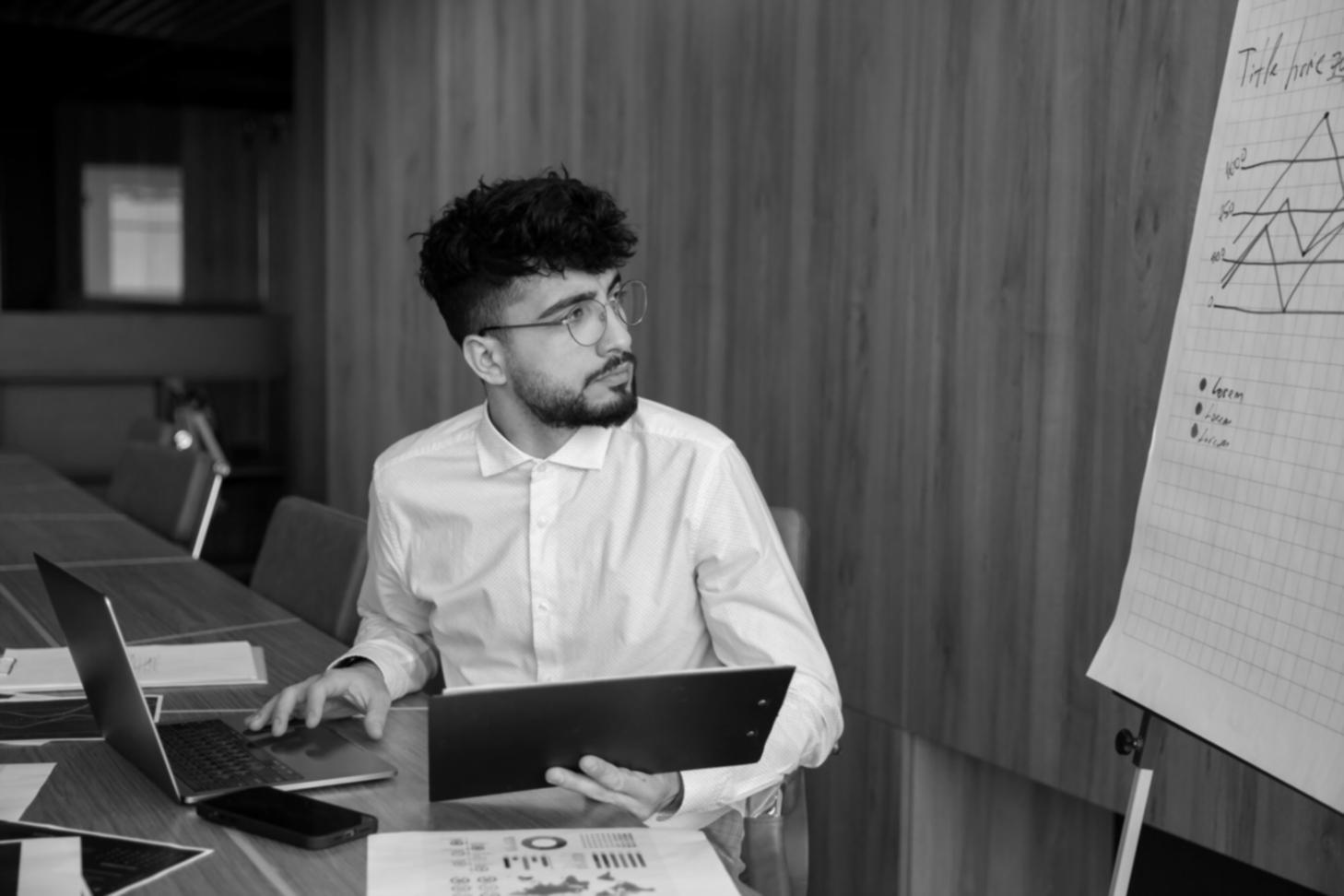 Professional workspace showing financial planning materials and communication tools